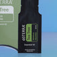 Close-up of the doTERRA Tea Tree .25 mL black sample sachet standing upright in front of its green pillow box on a blue background. doTERRA Tea Tree Essential Oil Sample (.25 mL)