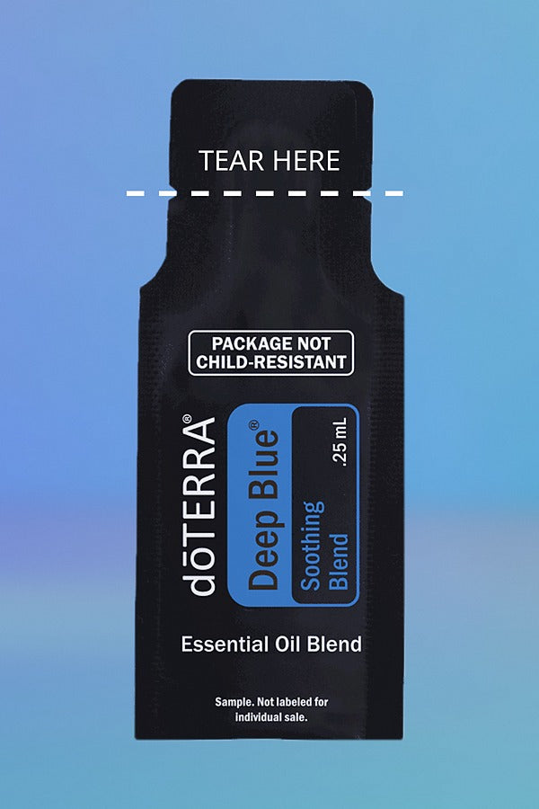 doTERRA Deep Blue Soothing Blend .25 mL sample sachet on a blue background with a dashed TEAR HERE line marking where to tear it open. doTERRA Deep Blue Essential Oil Sample (.25 mL)