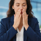 Professional woman at her desk inhaling doTERRA Adaptiv from her cupped hands. doTERRA Adaptiv Essential Oil Sample (.25 mL)