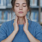 Student in a library touching doTERRA Adaptiv to her neck before studying. doTERRA Adaptiv Essential Oil Sample (.25 mL)