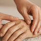 Gentle hand massage with doTERRA Balance on an older woman's hand and wrist. doTERRA Balance Essential Oil Sample (.25 mL)