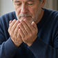 Older man at the breakfast table inhaling doTERRA Lemon from his cupped palms. doTERRA Lemon Essential Oil Sample (.25 mL)