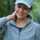 Woman on a trail after a run rubbing doTERRA Peppermint onto the back of her neck. doTERRA Peppermint Essential Oil Sample (.25 mL)