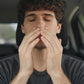 Young man in his car inhaling doTERRA Balance from his hands and wrists. doTERRA Balance Essential Oil Sample (.25 mL)