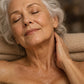 Older woman relaxing in a warm bath, massaging doTERRA Lavender into the back of her neck. doTERRA Lavender Essential Oil Sample (.25 mL)