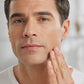 Man patting doTERRA Tea Tree onto his freshly shaved jawline in a bright bathroom. doTERRA Tea Tree Essential Oil Sample (.25 mL)