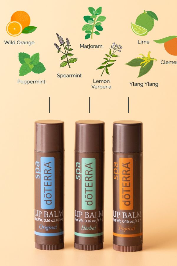 Three doTERRA lip balms with botanical illustrations on a beige background