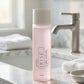 A bottle of Sofiten Kise 2-in-1 facial cleanser and toner stands on a white marble bathroom counter with a faucet and folded towels blurred in the background.