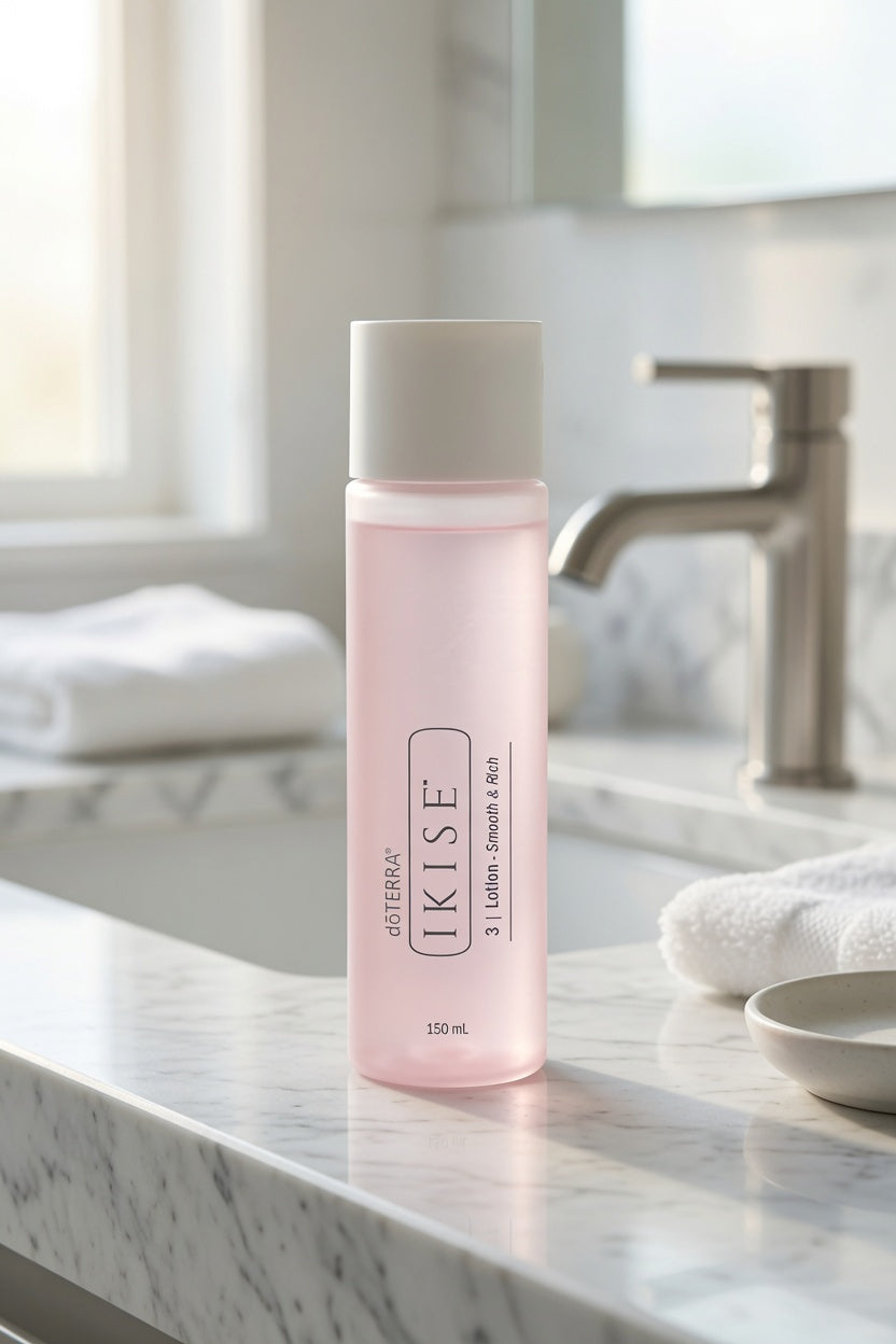 A bottle of Sofiten Kise 2-in-1 facial cleanser and toner stands on a white marble bathroom counter with a faucet and folded towels blurred in the background.