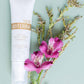 doTERRA body mist with pink flowers on a light green background