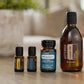 doTERRA Detox Bundle with RevitaZen, RevitaZen+, Lemon and Castor Oil on a kitchen table