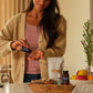 Woman using the doTERRA Digestive Bundle at her kitchen table