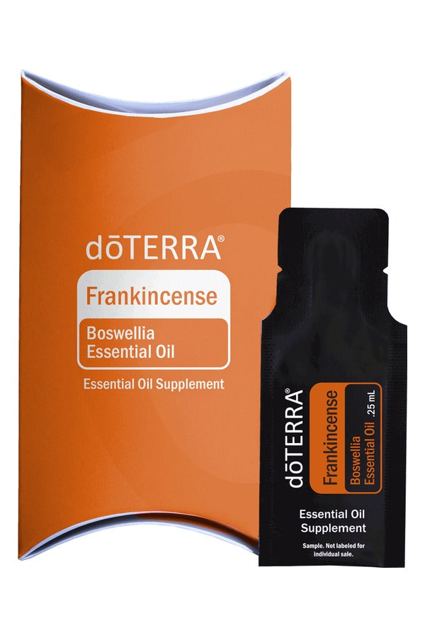doTERRA Frankincense .25 mL black sample sachet standing in front of its orange doTERRA pillow box on a white background. doTERRA Frankincense Essential Oil Sample (.25 mL)