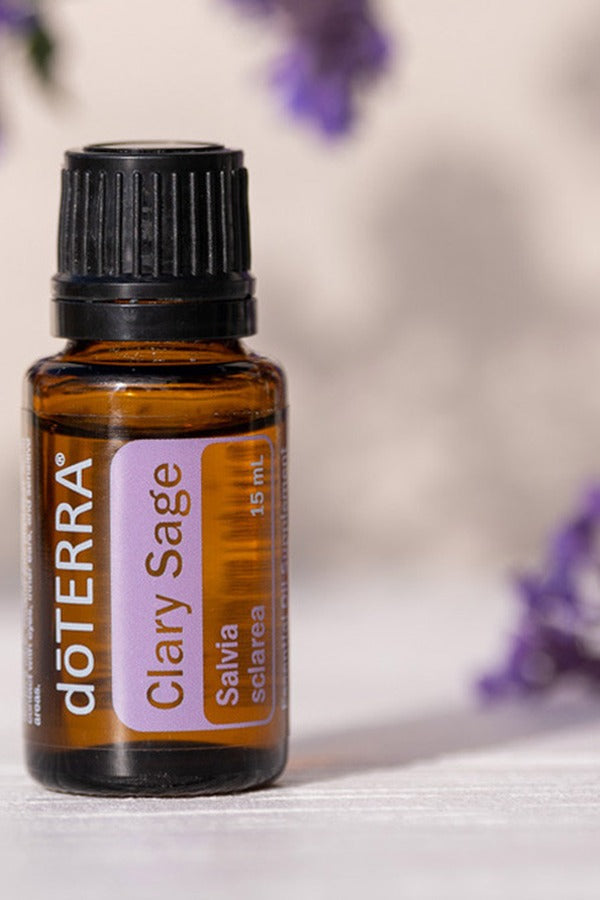 doTERRA Clary Sage essential oil bottle with lavender flowers