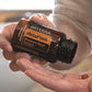 Hands holding doTERRA MetaPWR Metabolic Blend softgels