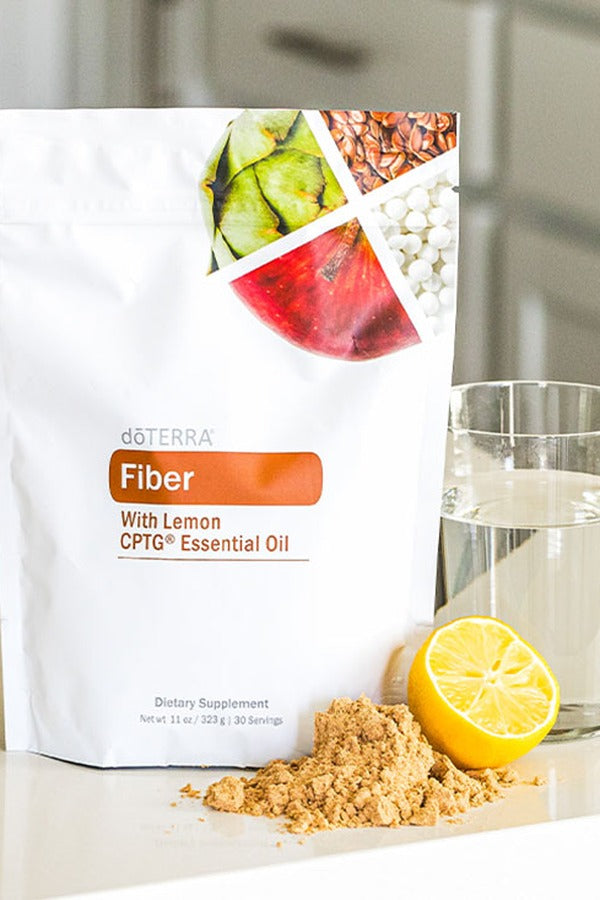 doTERRA Fiber pouch with lemon and a glass of water