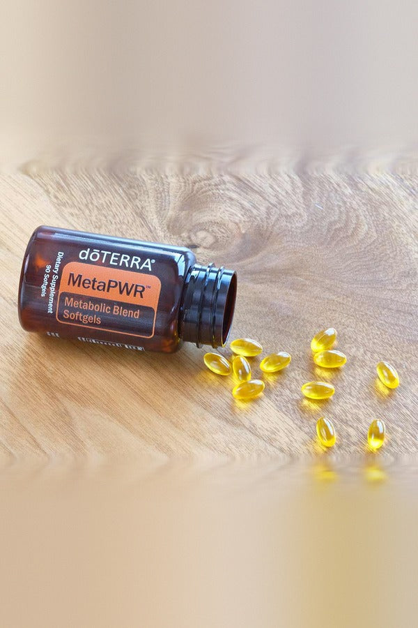 doTERRA MetaPWR softgels spilling from the bottle