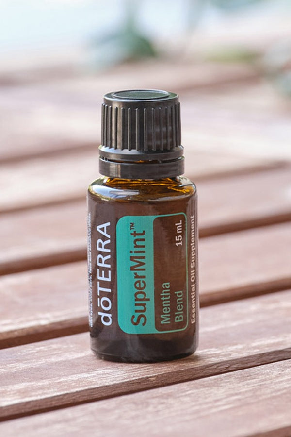 doTERRA SuperMint Mentha Blend bottle on a wooden table