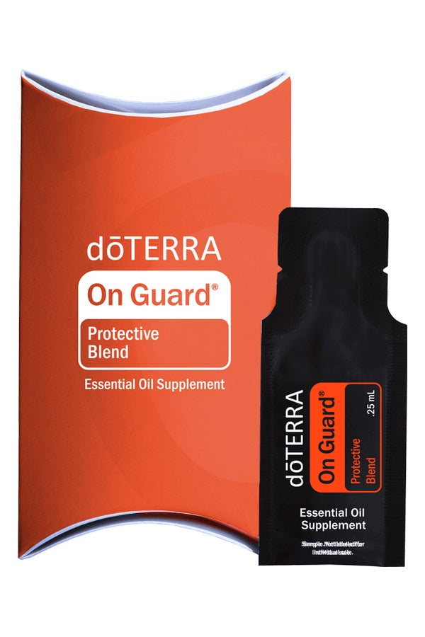 doTERRA On Guard Protective Blend .25 mL black sample sachet standing in front of its red-orange doTERRA pillow box on a white background. doTERRA On Guard Essential Oil Sample (.25 mL)