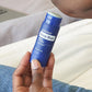 Hand holding a doTERRA Deep Blue Stick