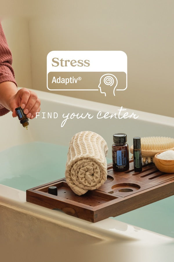 doTERRA Stress Bundle on a bath caddy beside a towel - find your center