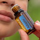 Woman inhaling the aroma of doTERRA Adaptiv Calming Blend