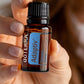 Hands holding a bottle of doTERRA Adaptiv Calming Blend