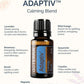 A doTERRA Adaptiv Calming Blend essential oil bottle centered on a light cream background with decorative faint citrus graphics. Text around the bottle lists ingredients and benefits: lavender, wild orange, rosemary, neroli, magnolia, spearmint, and copaiba.