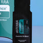 A single doTERRA Balance Grounding Blend essential oil blend sample sachet in black packaging, standing upright in front of a teal and blue branded box on a reflective light blue surface. doTERRA Balance Essential Oil Sample (.25 mL)