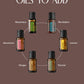 A promotional graphic on a muted brown background with the text 'POPULAR OILS TO ADD' above six small essential oil bottles arranged in a circle. The labeled bottles include Rosemary, RevitaZen, Lemon, Fennel, Ginger, and Geranium. doTERRA CASTOR OIL pack