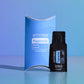 A doTERRA Peppermint Essential Oil Stand set against a blue gradient background, featuring a blue display stand and a black single-use essential oil vial. doTERRA Peppermint Essential Oil Sample (.25 mL)