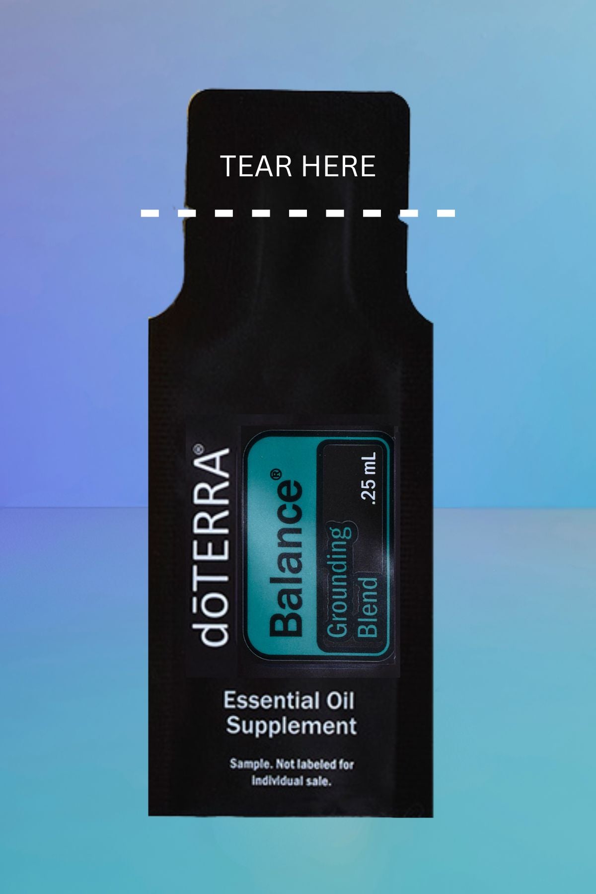 A single doTERRA Balance Grounding Blend essential oil supplement sample sachet in black packaging, shown against a blue gradient background with a dashed line indicating tear location. doTERRA Balance Essential Oil Sample (.25 mL)