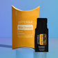 A doTERRA Wild Orange essential oil supplement set featuring a large yellow-orange curved box and a smaller black single-use sachet, displayed on a reflective light blue surface against a blue gradient background. doTERRA Wild Orange Essential Oil Sample (.25 mL)