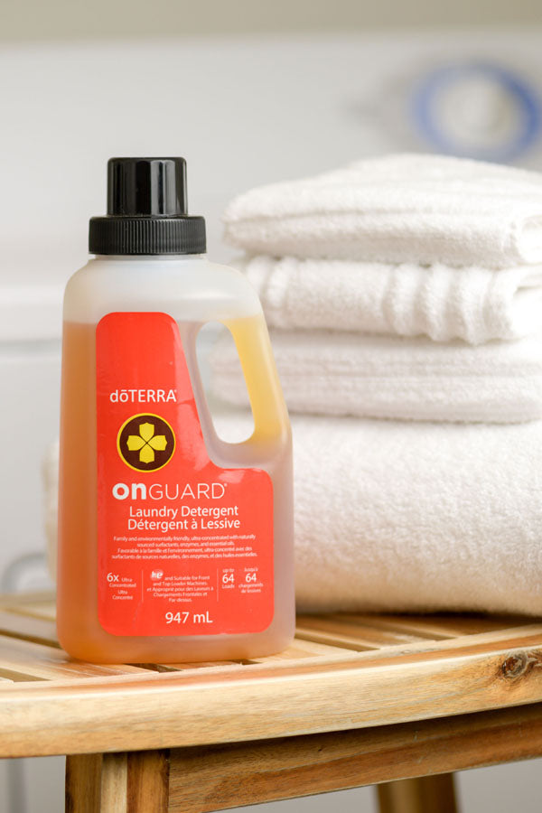 doTERRA onGuard laundry detergent bottle with towels in the background